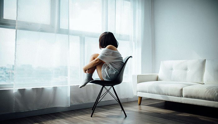 Women Sit on Black Chair